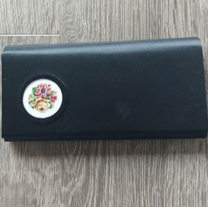 Petit point from Vienna black silk satin clutch with floral petit point.